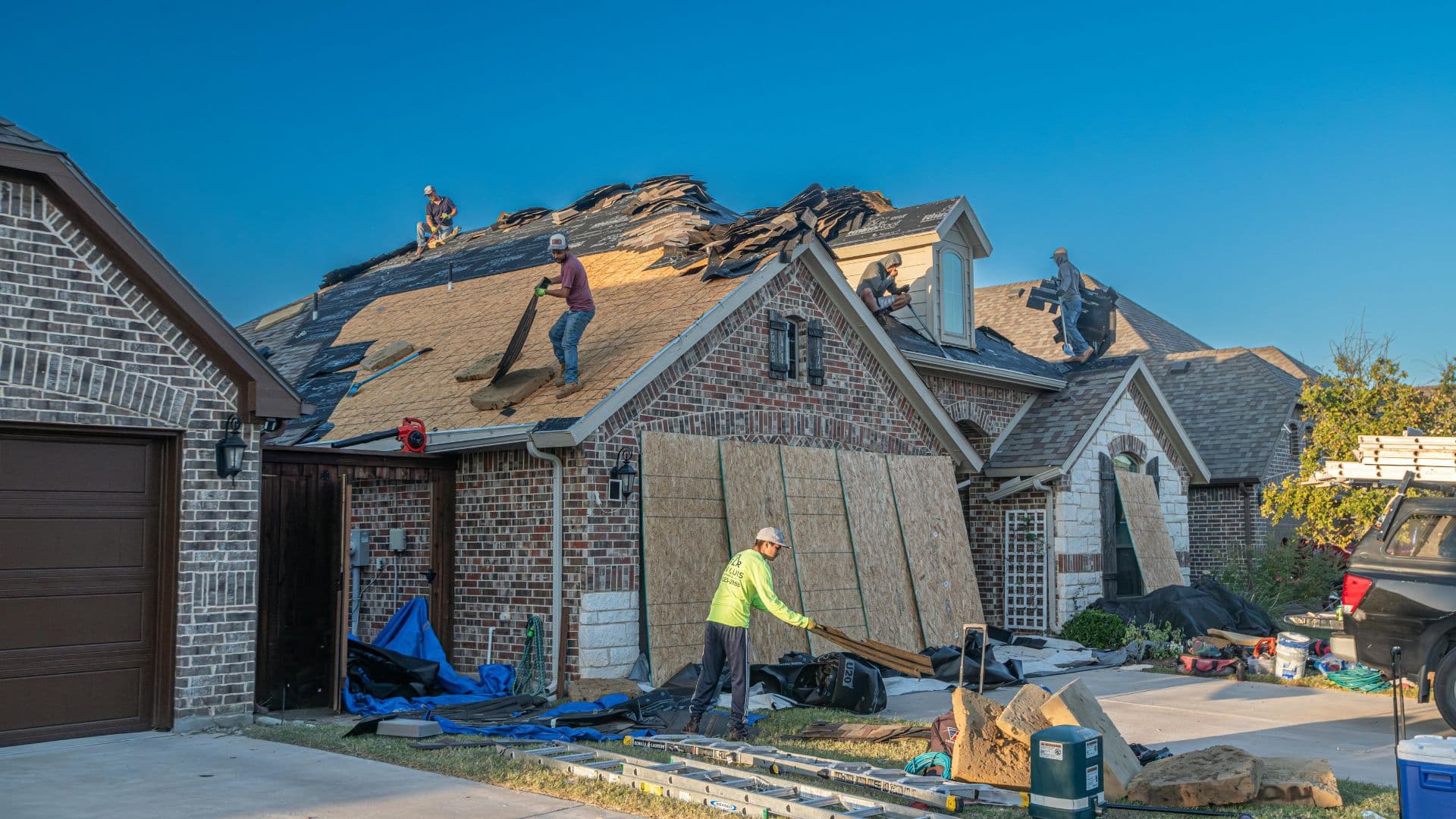 Whitetail Roofing crew working across a residential re-roof project