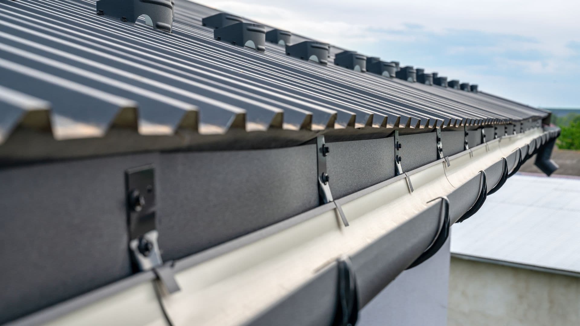 Standing seam metal roof edge and gutter detail